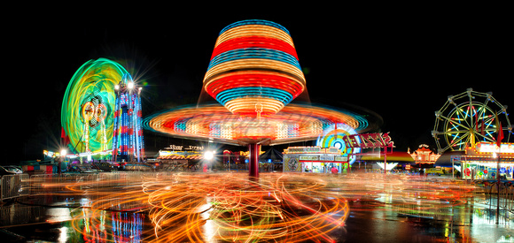 Carnival Rides In Motion.  Photostitched Panoramic.